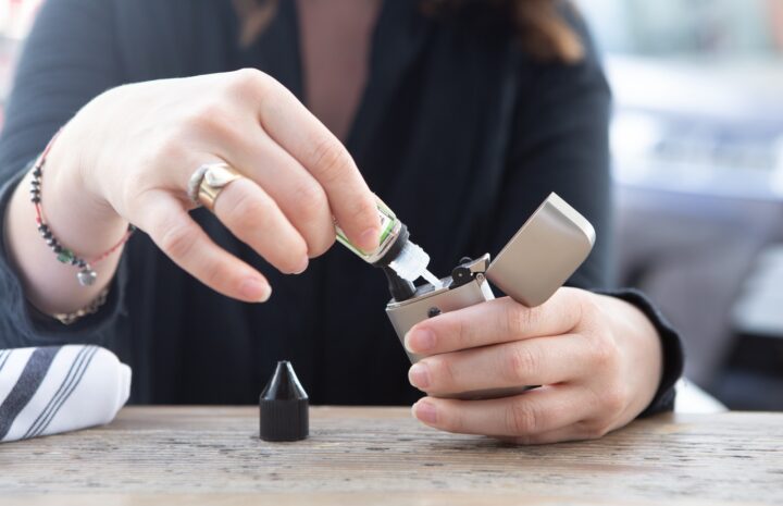 person holding silver flip lighter